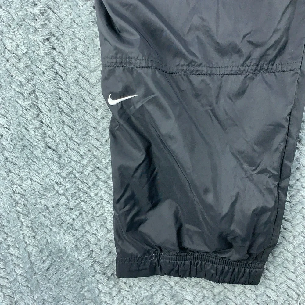 Nike Kids L 12-14 Black Nylon Windbreaker Track Pants Lined Zipper Cuffs Joggers